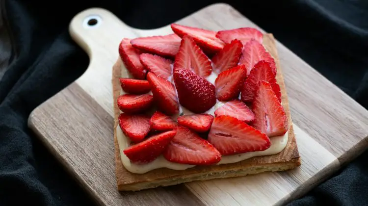 Sliced Strawberries over Squared Bread on Wooden Tray